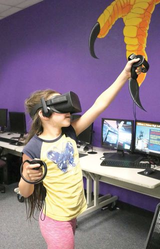 A student at William J. Palmer High School calibrates the VR system.