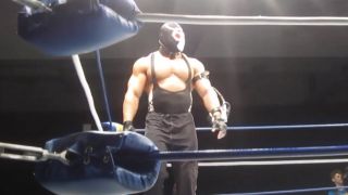 Brian Cage dressed as Bane during start of wrestling match for FSCW