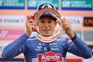 SANREMO ITALY MARCH 16 Jasper Philipsen of Belgium and Team Alpecin Deceuninck poses at podium as race winner during the 115th MilanoSanremo 2024 a 288km one day race from Pavia to Sanremo UCIWT on March 16 2024 in Sanremo Italy Photo by Dario BelingheriGetty Images