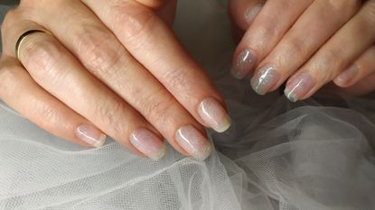 close-up of spring nail colors on a woman's hand