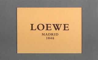 One side of Loewe’s extra thick, gilt-edged card had a leather-like texture...