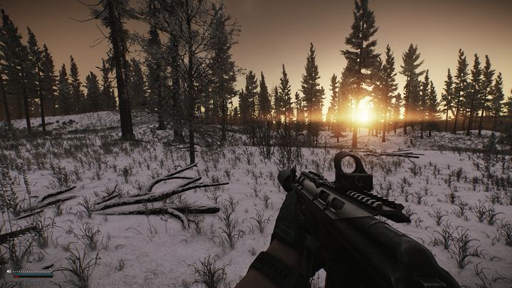 Escape from Tarkov: person carrying a gun through snowy terrain at sunset