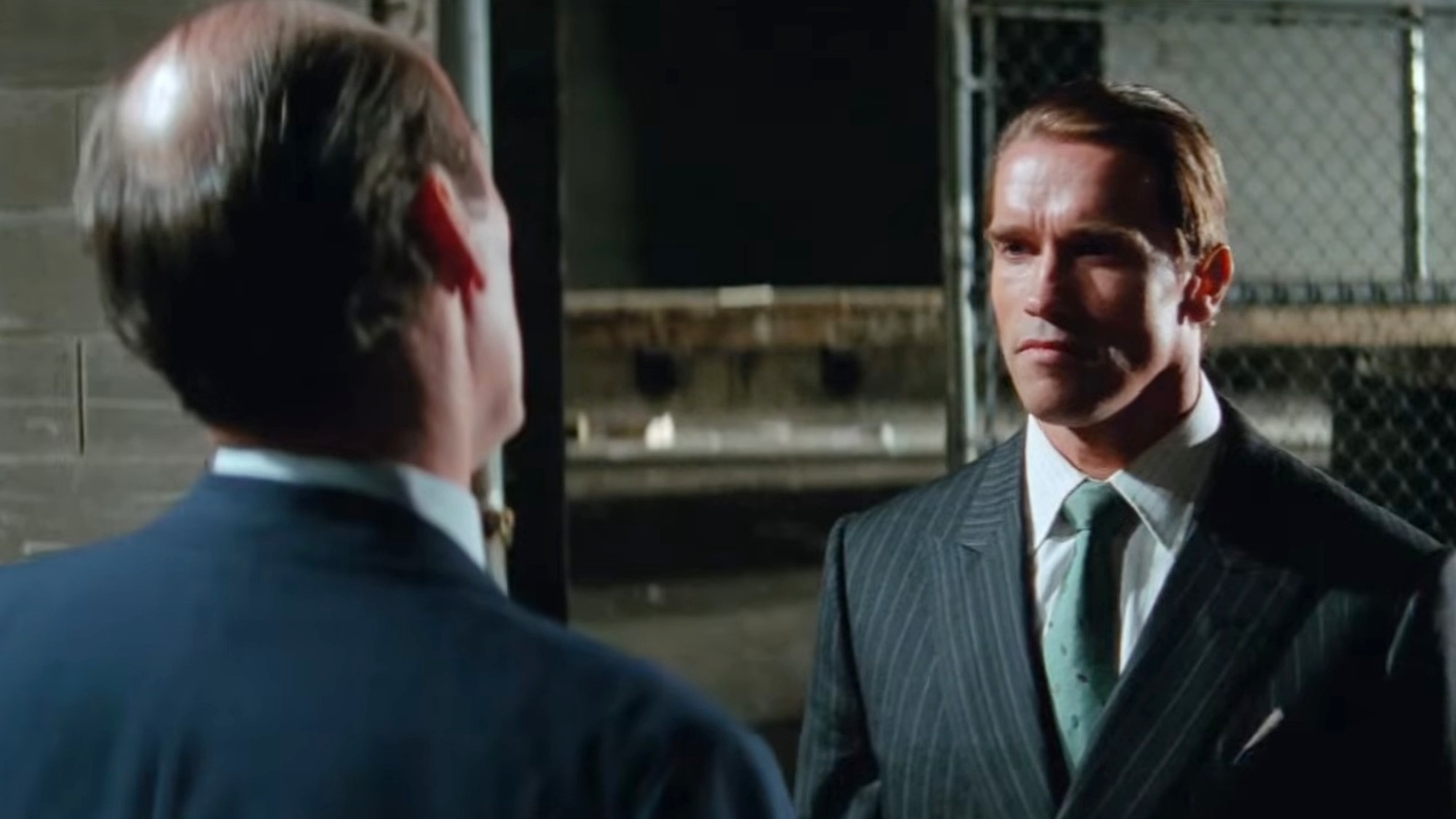 Arnold Schwarzenegger have a stern talk in Raw Deal