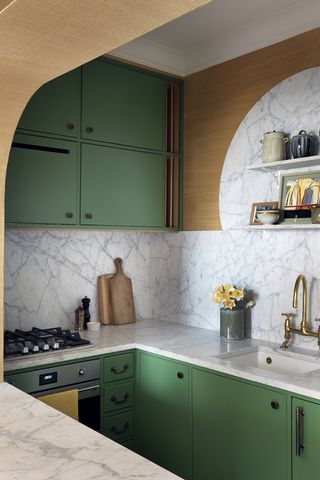 Small green kitchen with curved hatch