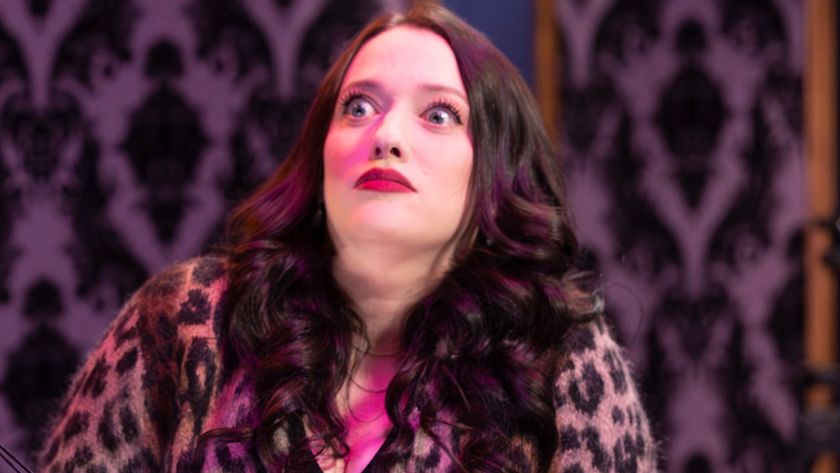 Kat Dennings as Riley reacting in shock. 