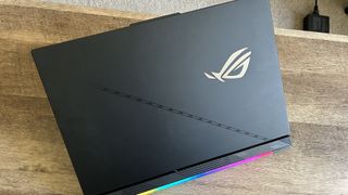 Asus ROG Strix Scar 18 from the back showing RGB lighting and lid design