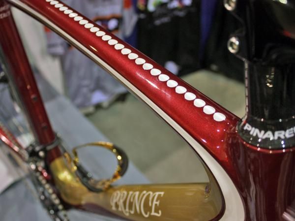 A string of 'pearls' decorate the top tube of this VeloColour-finished Pinarello Prince.
