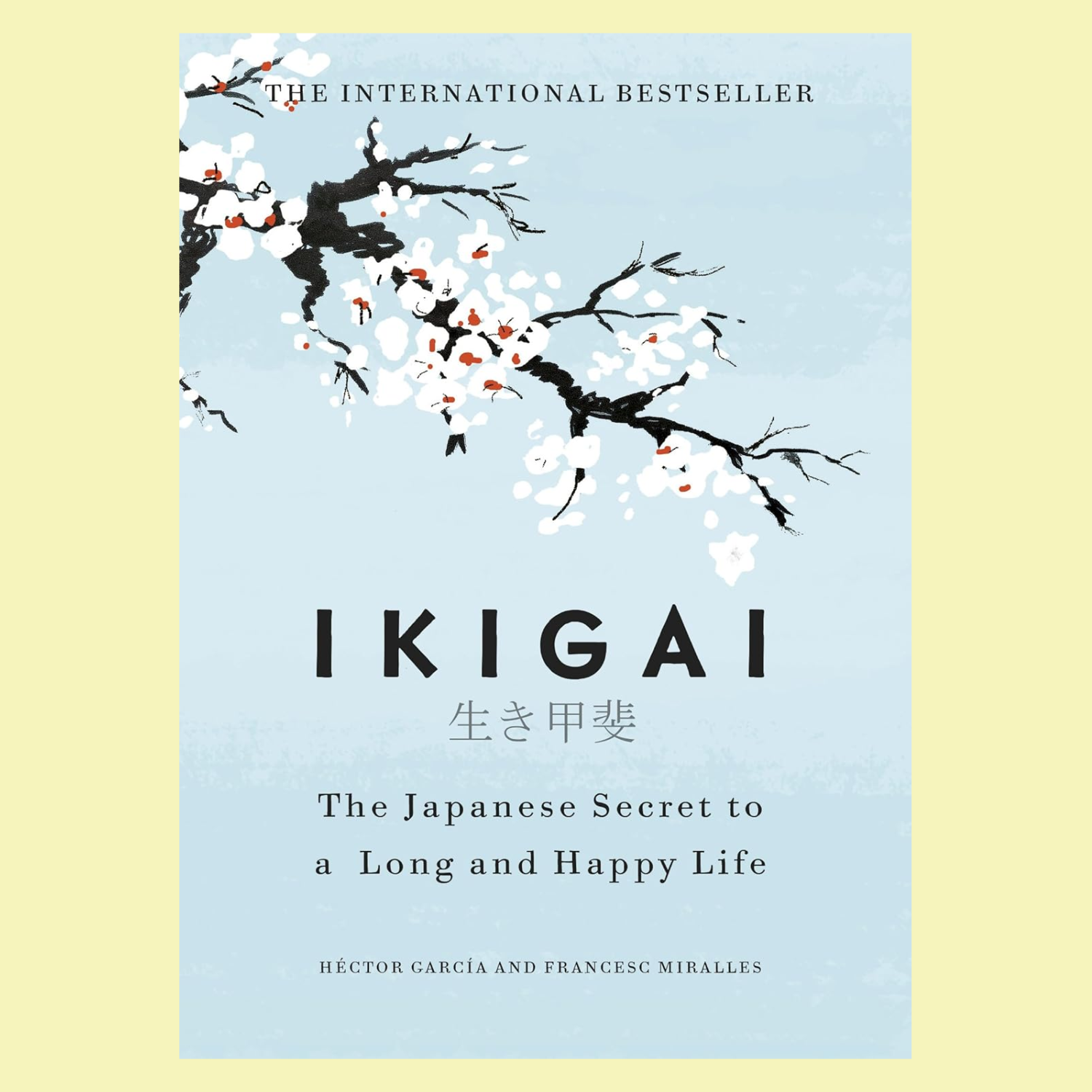 A light blue book with a painted cherry blossom blanch