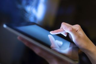 Woman holding digital tablet computer