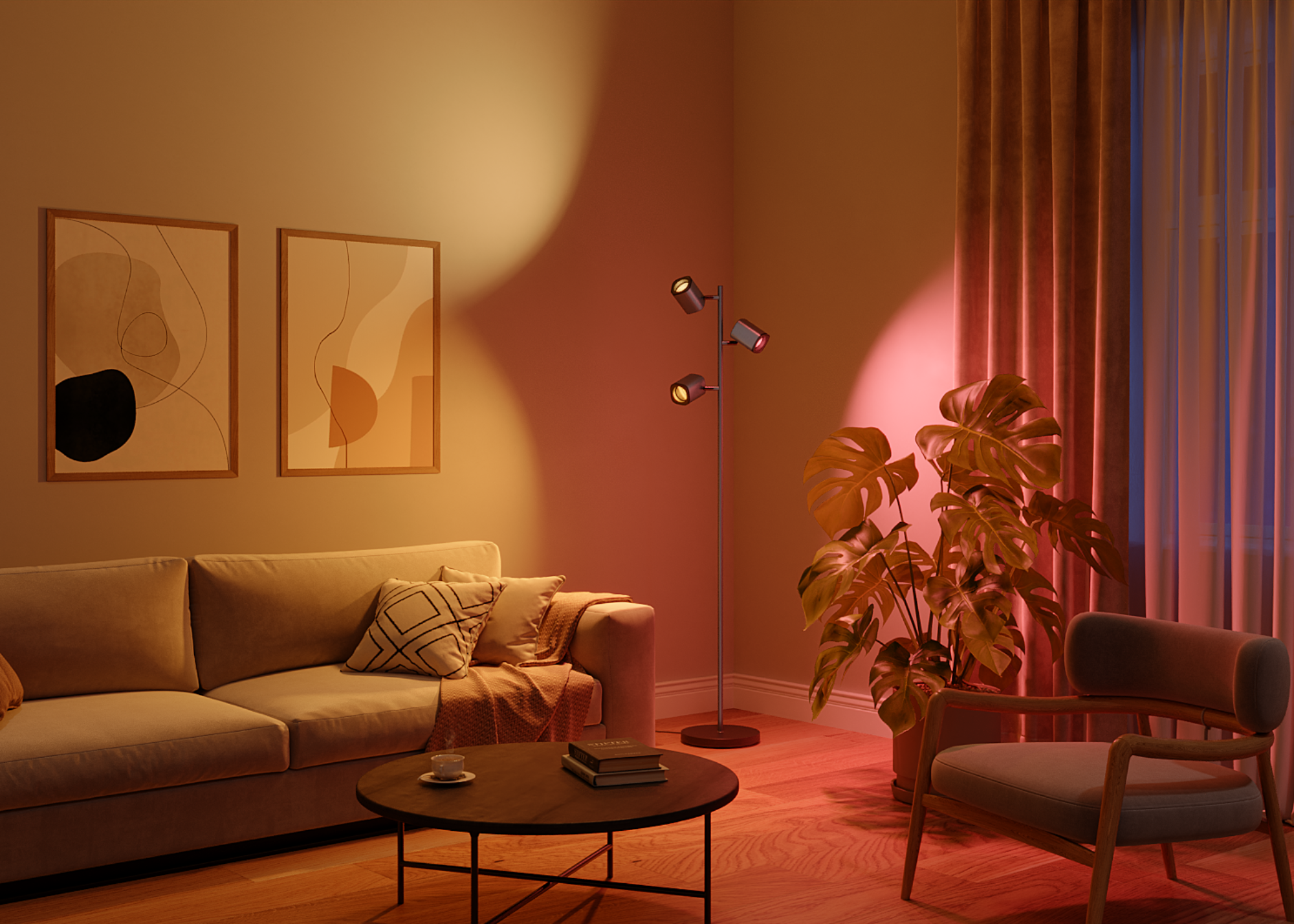 A minimalist living room with a sofa, an armchair, a round coffee table, framed art, a potted plant, and a tree lamp