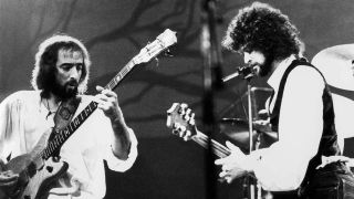 Photo of Lindsey BUCKINGHAM and John McVIE and FLEETWOOD MAC, John McVie & Lindsey Buckingham performing live onstage