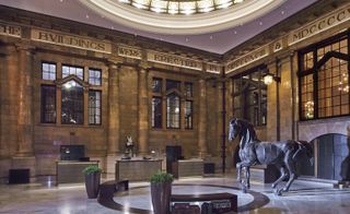 600kg, 3m high bronze horse station by Sophie Dickens in the lobby.