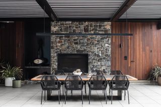 The outdoor dining space in one of the courtyards at Tinderbox House by Studio Ilk Architecture