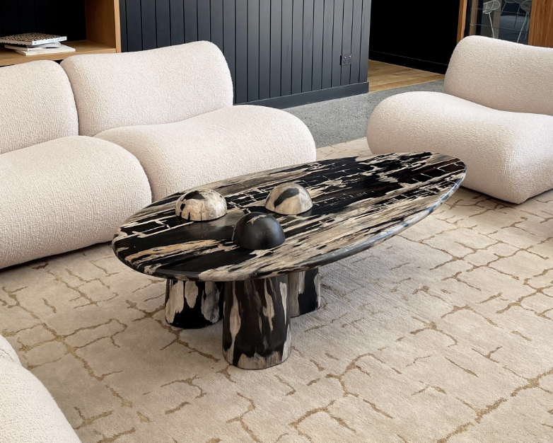 black and white marble coffee table on a white rug