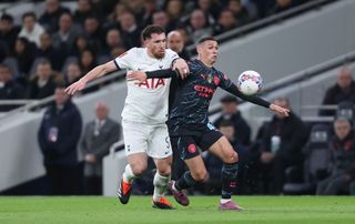 Manchester City&#039;s Phil Foden and Tottenham Hotspur&#039;s Pierre-Emile Hojbjerg during the Emirates FA Cup Fourth Round match between Tottenham Hotspur and Manchester City at Tottenham Hotspur Stadium on January 26, 2024 in London, England. (Photo by Rob Newell - CameraSport via Getty Images)