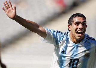 Carlos Tevez celebrates after scoring for Argentina against Paraguay at the 2004 Olympics in Athens.