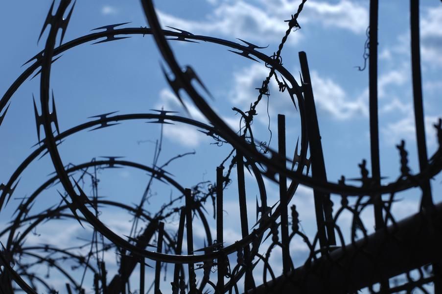 Canadian woman climbs barbed wire fence to stop plane departure