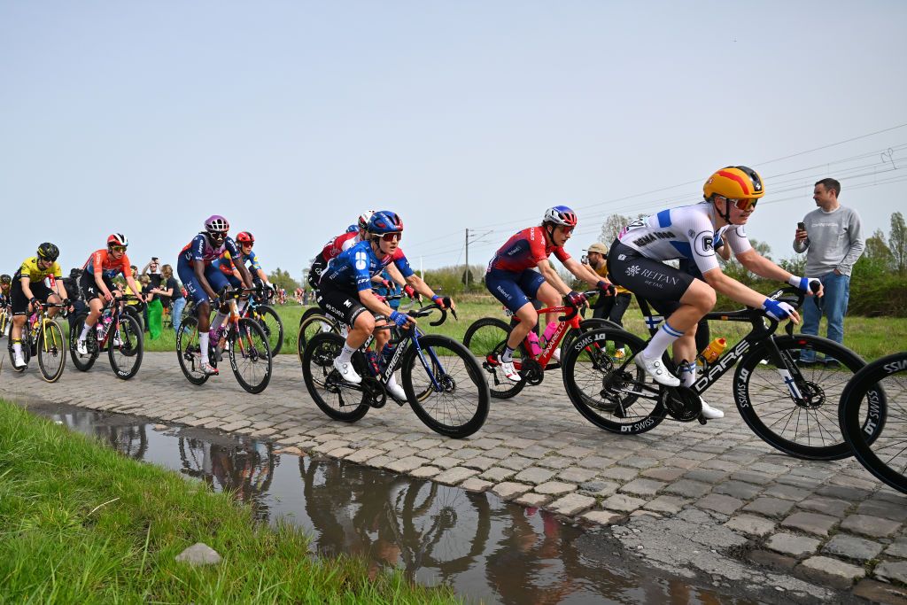 ROUBAIX FRANCE APRIL 06 LR Teniel Campbell of Trinidad and Tobago and Team Liv AlUla Jayco Amber Kraak of The Netherlands and Team FDJSuez Maggie ColesLyster of Canada and Team Roland Anniina Ahtosalo of Finland and Team UnoX Mobility compete passing through the Hornaing a Wandignies cobblestones sector during the 4th ParisRoubaix Femmes 2024 a 1485km one day race from Denain to Roubaix on UCIWWT April 06 2024 in Roubaix France Photo by Luc ClaessenGetty Images