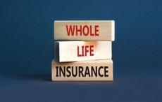 Three wooden blocks agaisnt a blue blackground. Each block has a word on it, spelling out "whole life insurance."