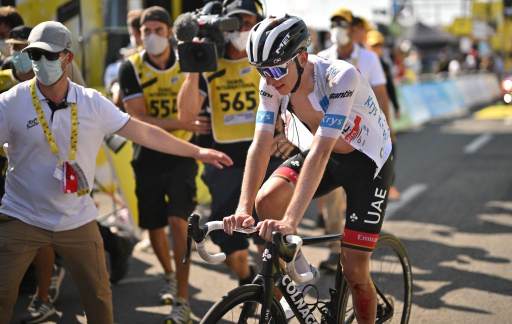 UAE Team Emirates teams Slovenian rider Tadej Pogacar wearing the best young riders white jersey CR reacts after the finish line of the 18th stage of the 109th edition of the Tour de France cycling race 1432 km between Lourdes and Hautacam in the Pyrenees mountains in southwestern France on July 21 2022 Photo by Marco BERTORELLO AFP Photo by MARCO BERTORELLOAFP via Getty Images