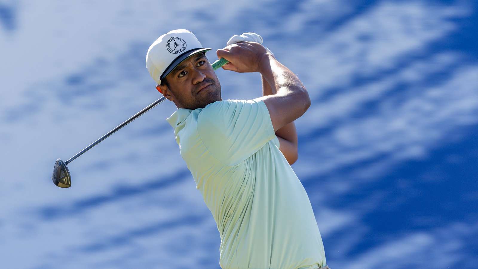 Tony Finau hits a fairway wood off the tee