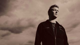 Josh Homme pictured against the sky