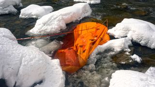 where not to camp: tent in icy water
