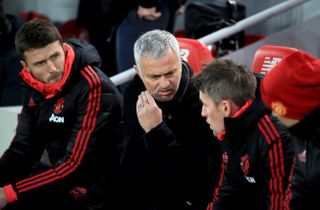 Jose Mourinho, centre, during his final game in charge against Liverpool