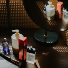 Line up of skincare products on dressing table