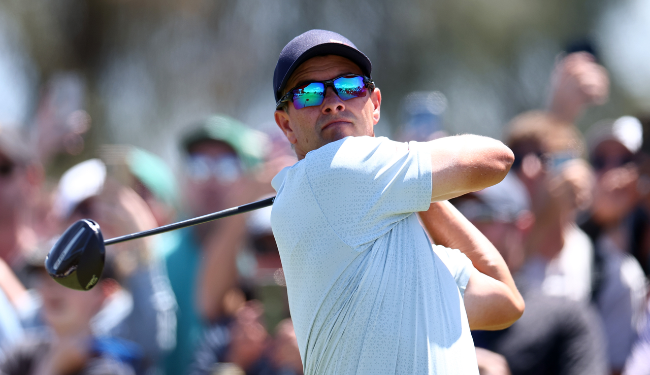 Adam Scott hits driver off the tee 