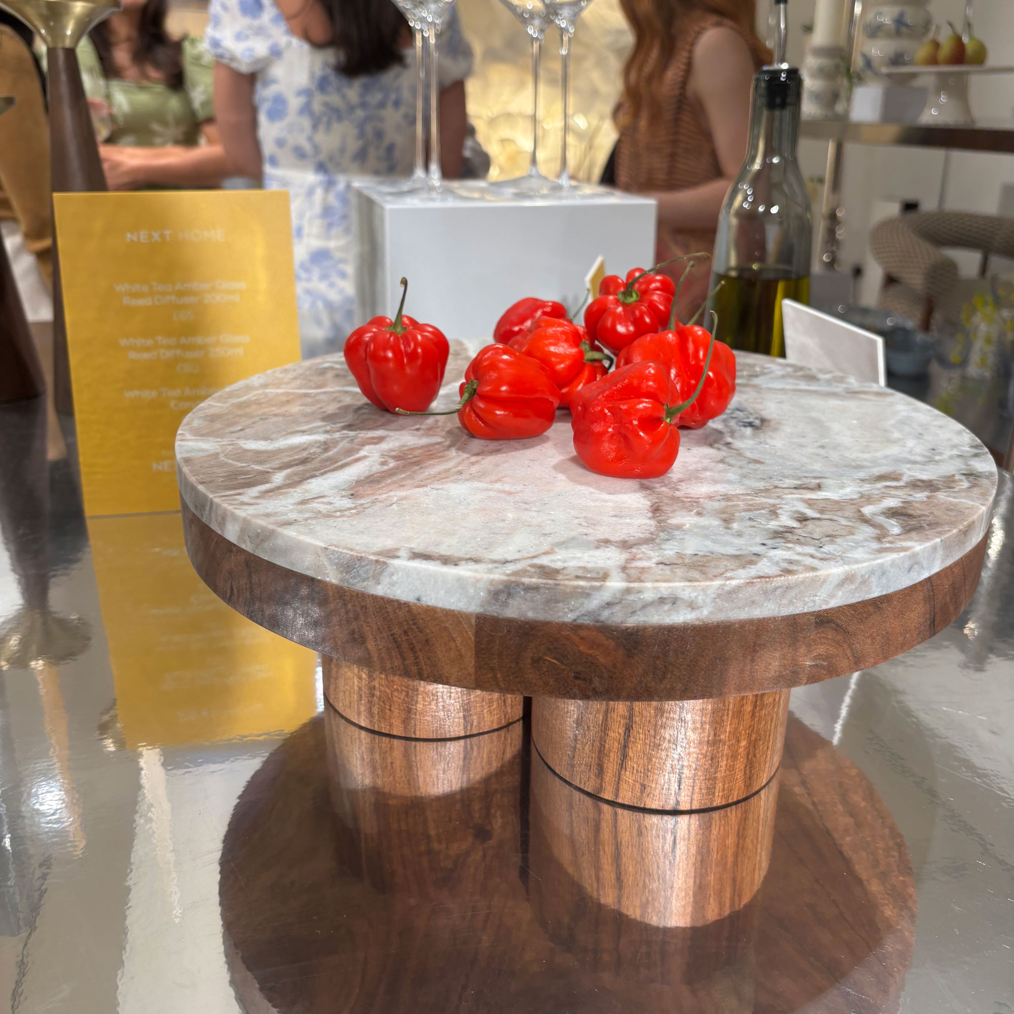 Marble and wood serving platter on mirrored box