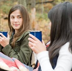 friends having coffee in the woods