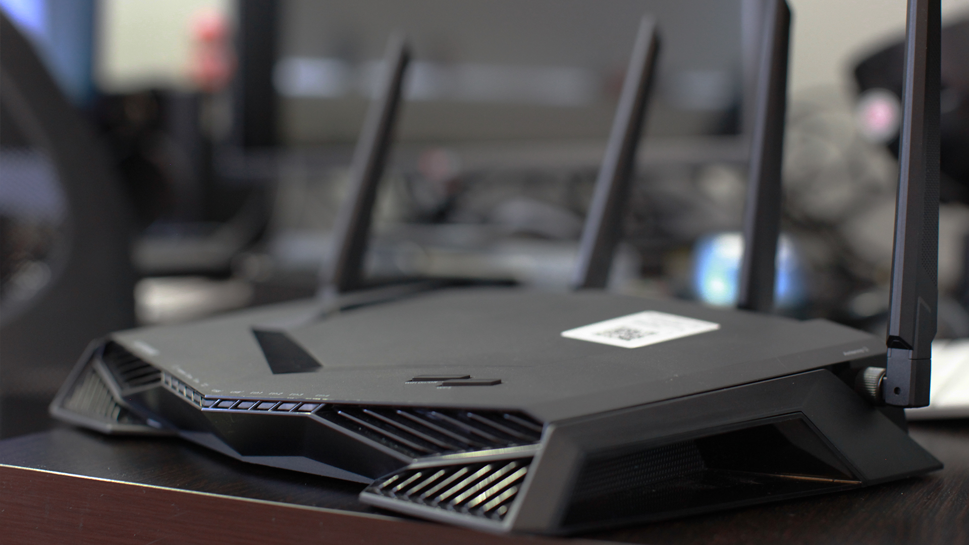 Netgear Nighthawk Pro Gaming XR500 on top of a brown desk