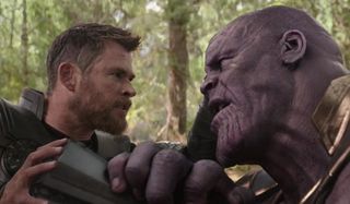 Avengers: Infinity War Thor pushes the ax into Thanos at Wakanda