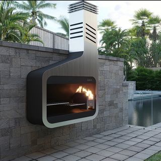 wall-hung outdoor fireplace next to a pool
