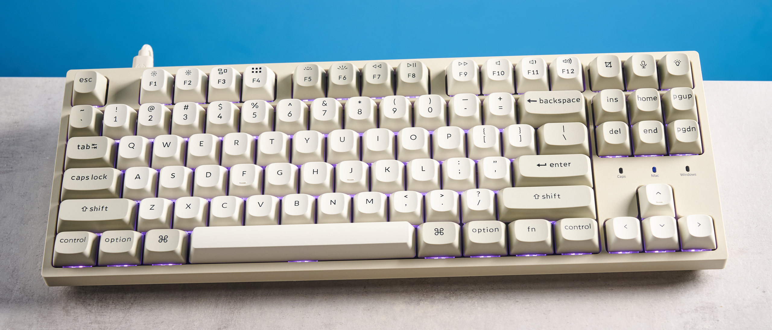 Keychron C1 Pro 8K photographed in front of a blue background. 
