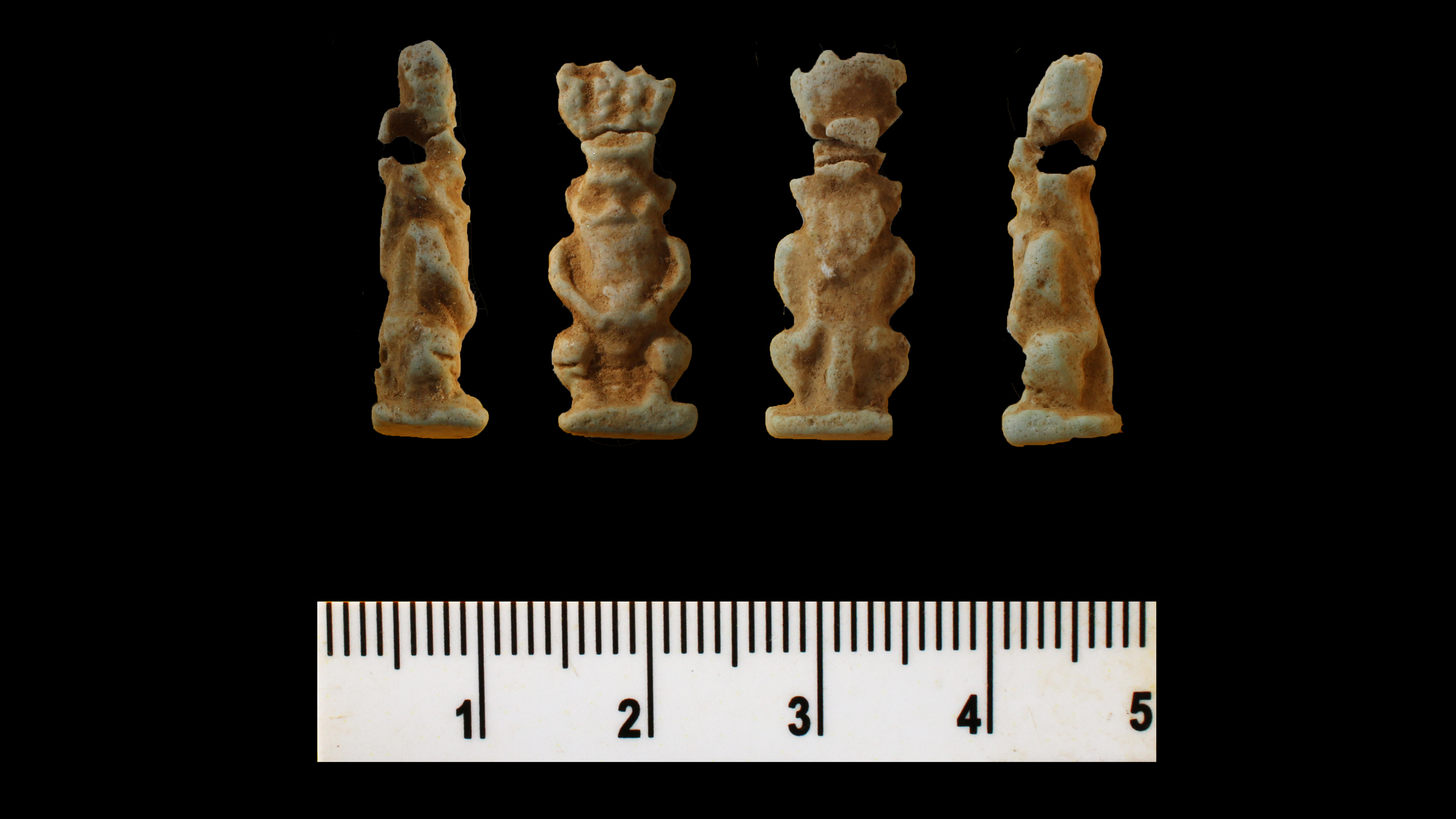 Egyptian amulets above a ruler