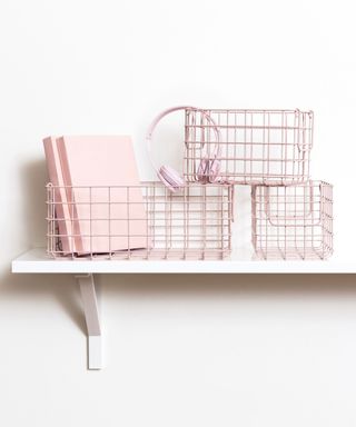 Pino Mustardmade baskets on white shelf and wall