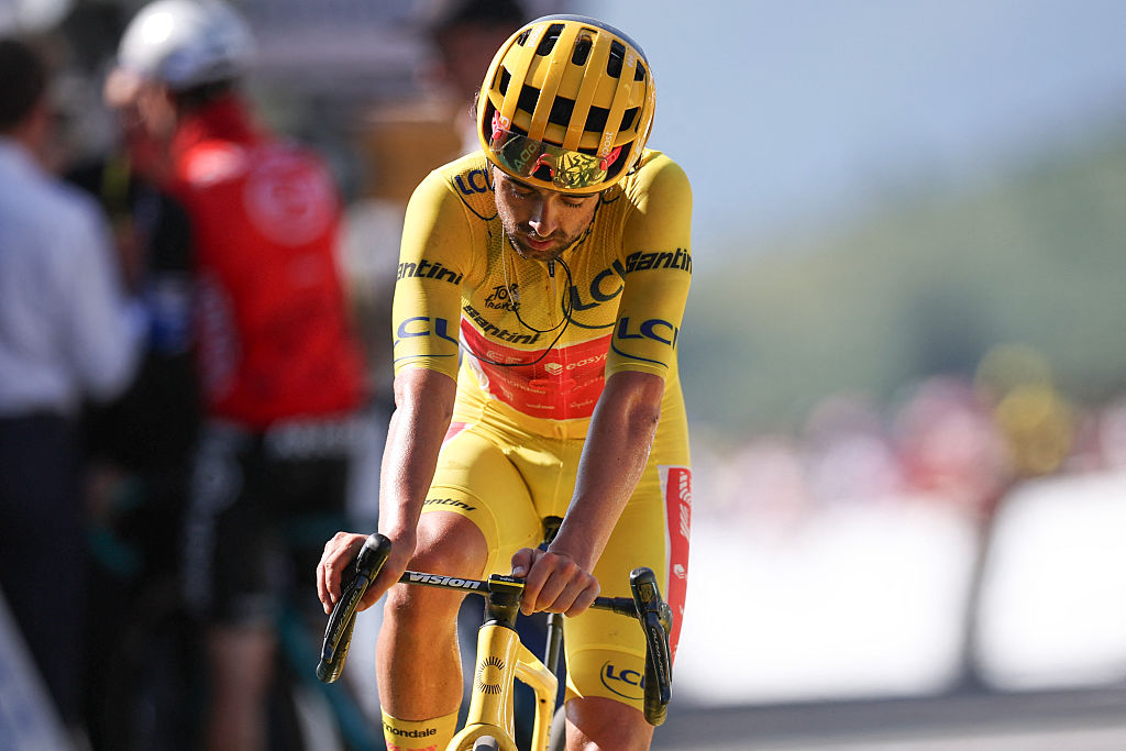 EF Education - EasyPost team's Irish rider Ben Healy wearing the overall leader's yellow jersey cycles to the finish line of the 12th stage of the 112th edition of the Tour de France cycling race, 180.6 km between Auch and Hautacam, in the Pyrenees mountains of southwestern France, on July 17, 2025. (Photo by Anne-Christine POUJOULAT / AFP)