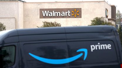 An Amazon Prime van parked in front of a Walmart store