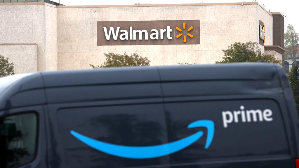 An Amazon Prime van parked in front of a Walmart store