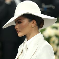 Zendaya on the 2025 Met Gala red carpet wearing a white suit