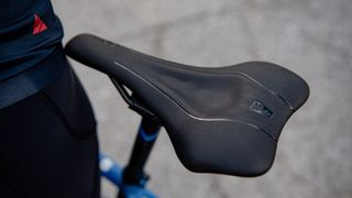 A black SQlab saddle fitted to a blue bike