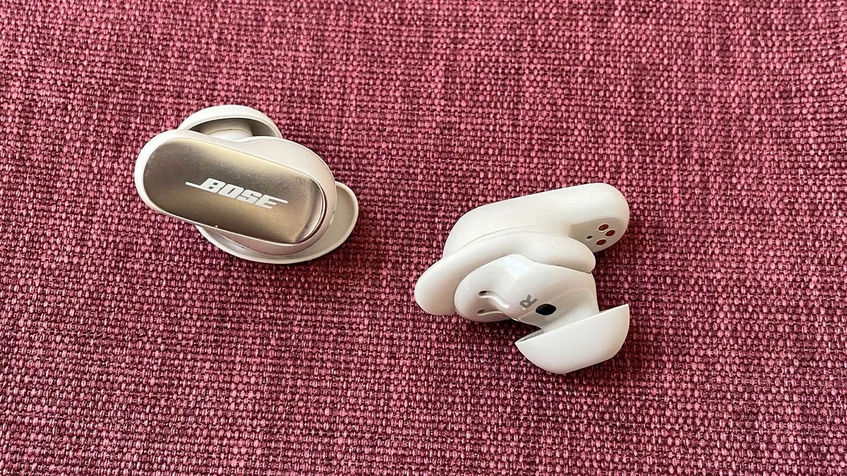 Bose QuietComfort Ultra Earbuds on a purple background