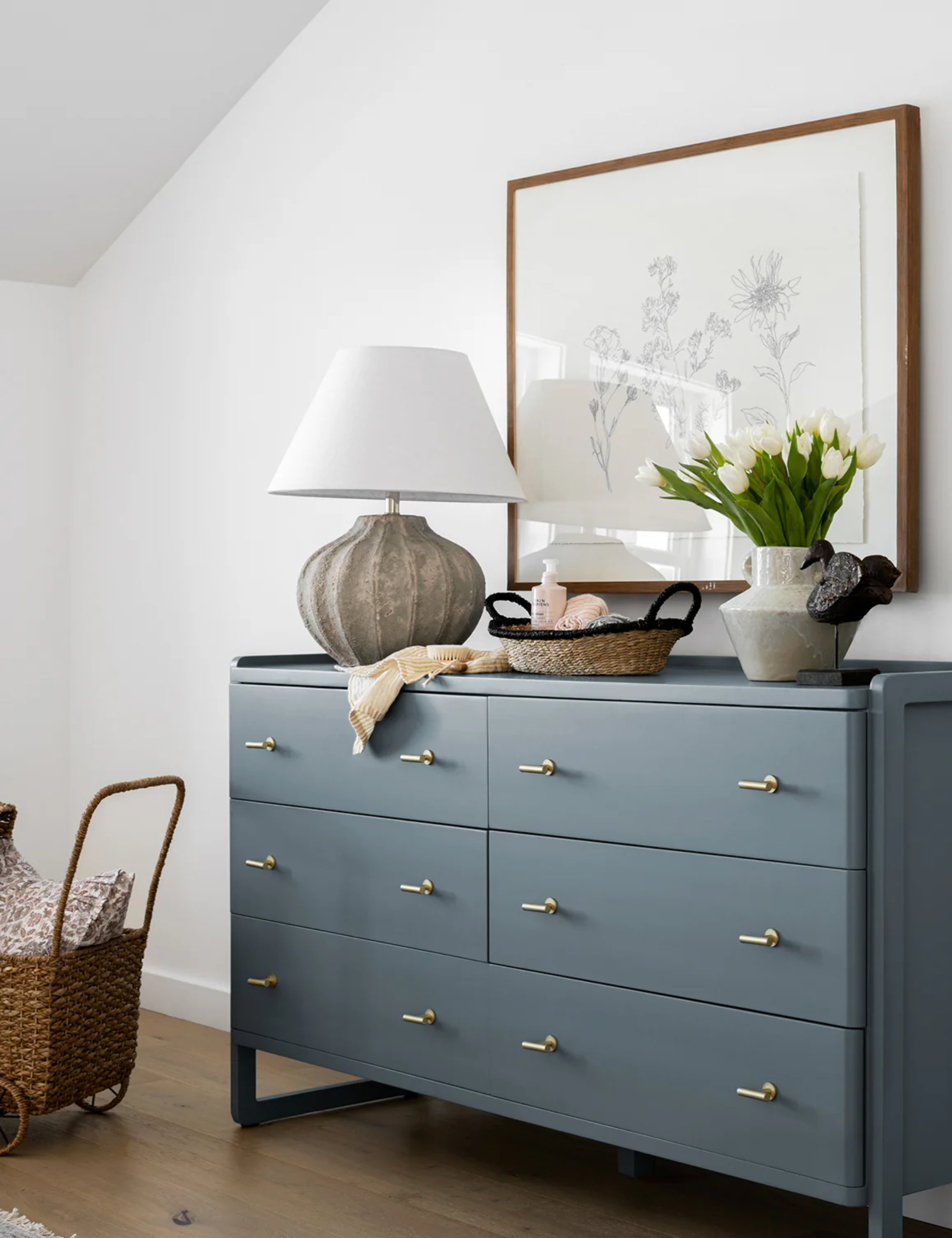 Blue dresser pictured in a neutral nursery