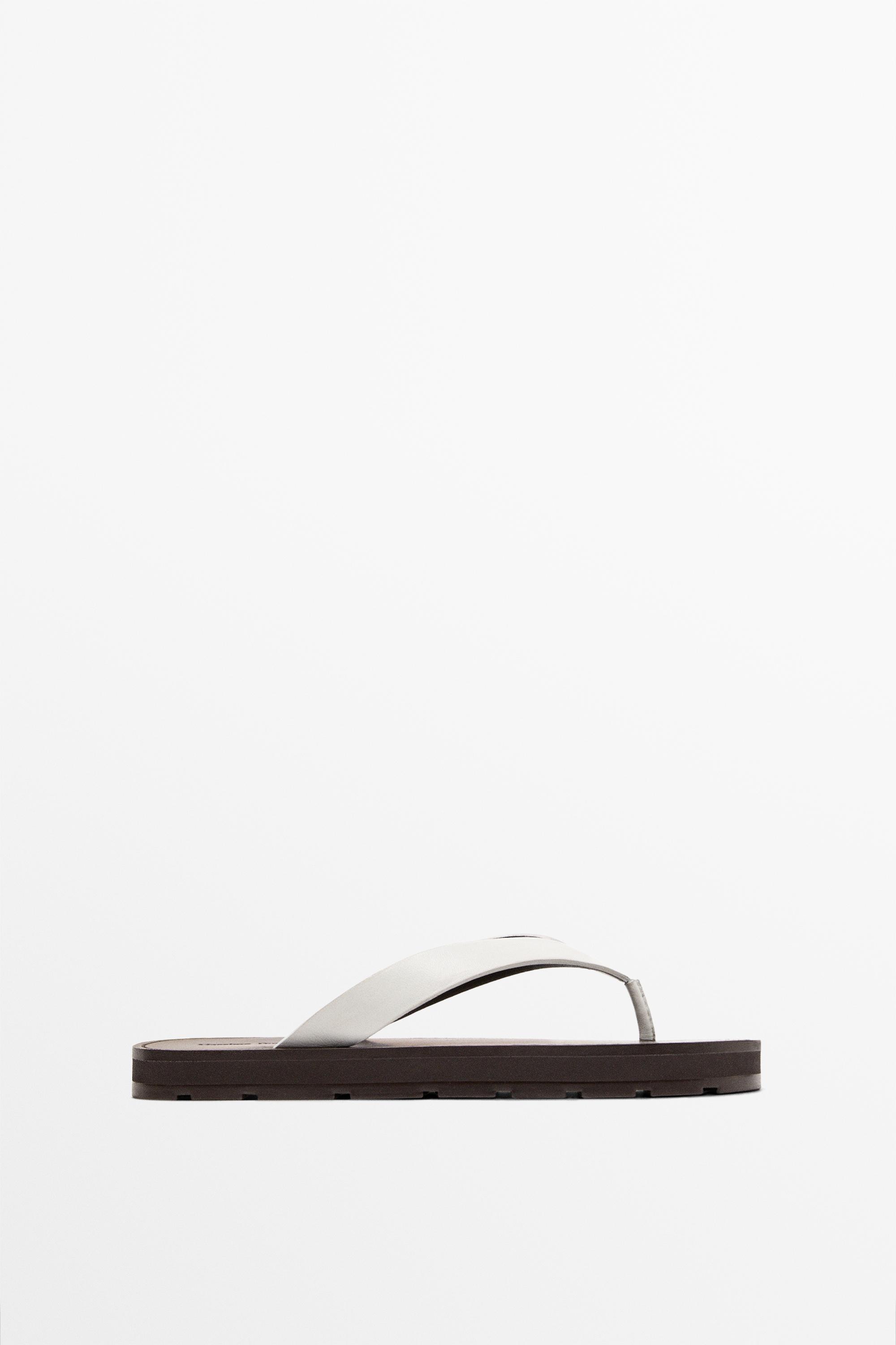 A white Massimo Dutti flip-flop