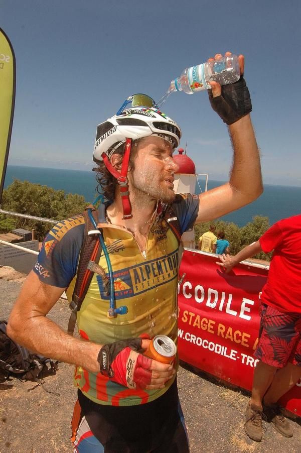 Isaac Tonello pours cool spring water over his head.