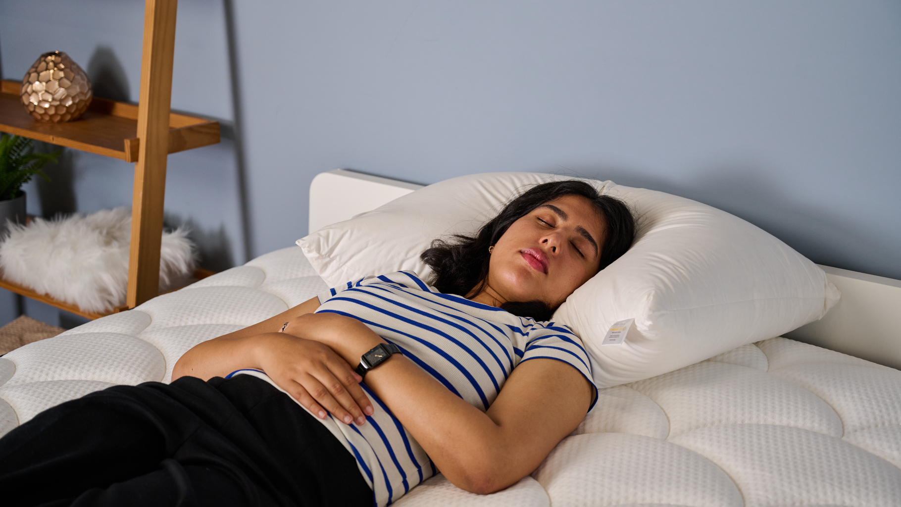 TG Bedding writer Becky George sleeping on her back on the Norvegr 100% Down Pillow