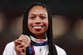 Bronze medalist Allyson Felix of Team USA holds her medal on the podium during the medal ceremony for the Women's 400m on day fourteen of the Tokyo 2020 Olympic Games at Olympic Stadium on August 06, 2021 in Tokyo, Japan.