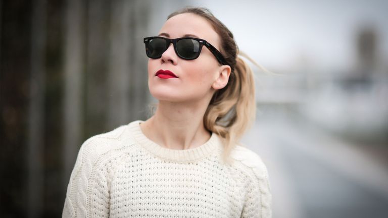 Woman wearing ray-ban sunglasses